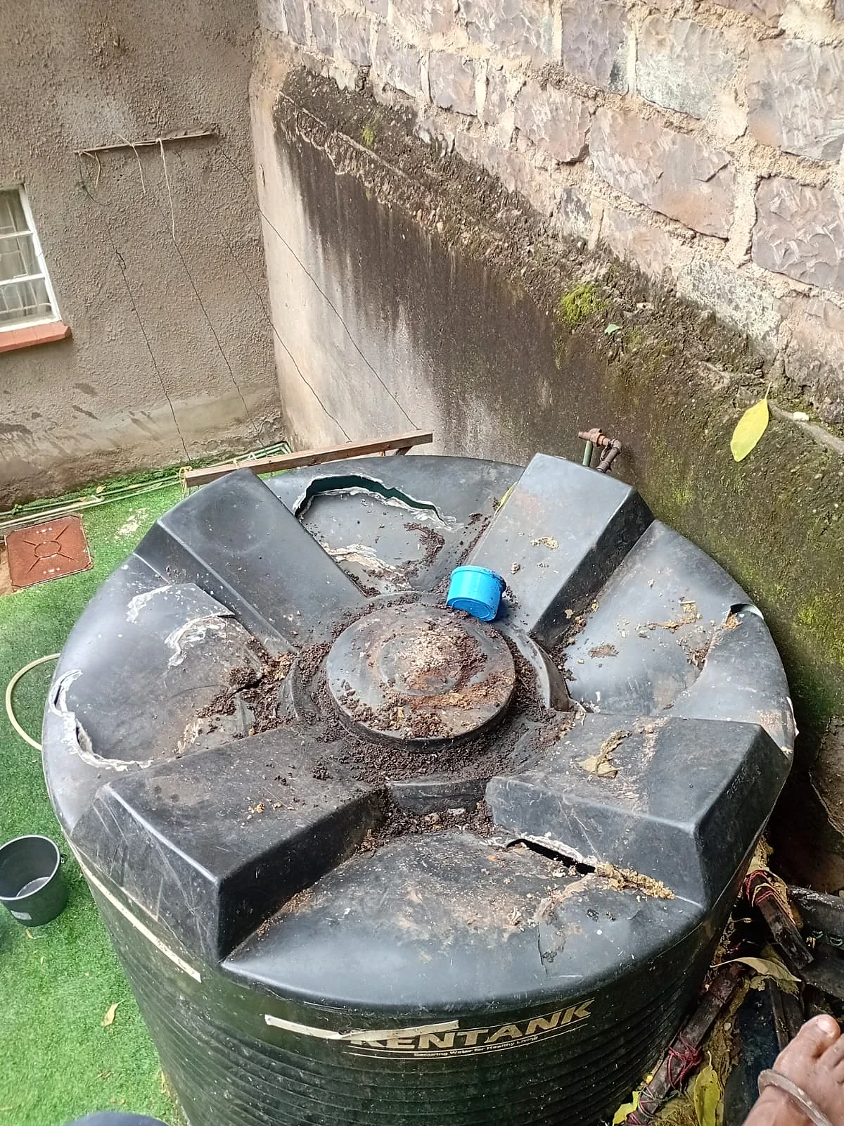Damaged tank base fitting before repair