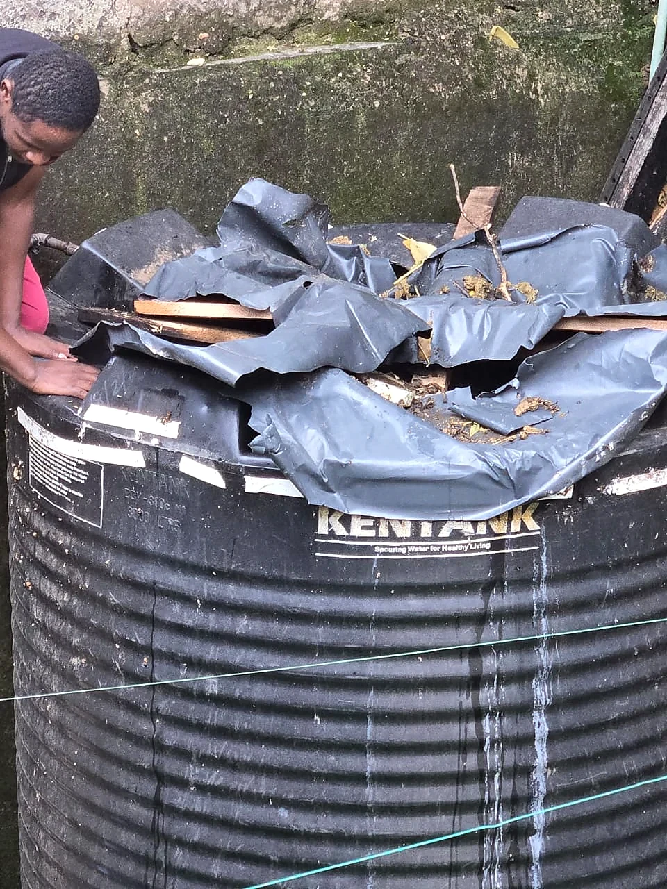 Damaged tank top before repair